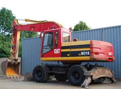 Колесный экскаватор CATERPILLAR - Россия